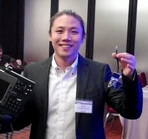 Ang Cui, a Fifth Year Grad Student from Columbia University - Displaying an External Circuit Board Used to Hack a Cisco IP Phone 